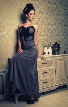 elegant woman in anthracite evening dress