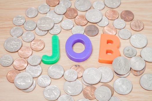 Job alphabet with various US coins, stock photo
