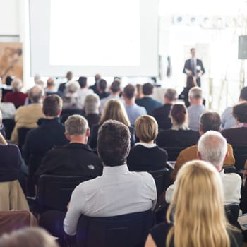 Speaker Giving a Talk at Business Meeting. Audience in the conference hall. Business and Entrepreneurship.
