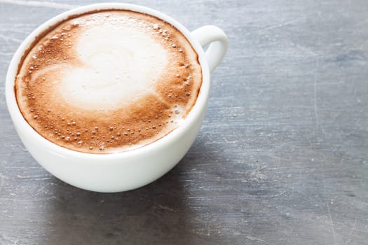 Coffee cup on grey background, stock photo