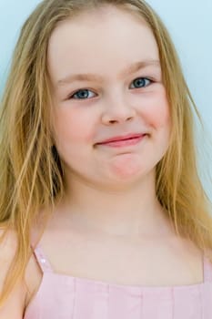Portrait of cute girl with blond hair