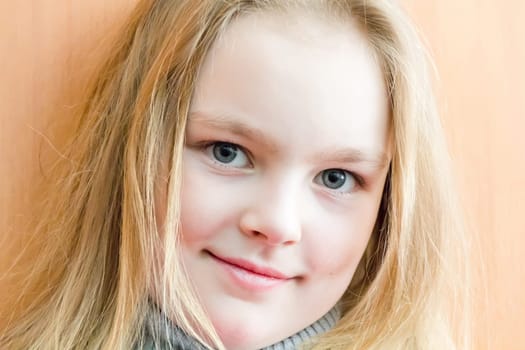 Portrait of cute girl with blond hair