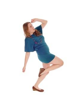A young blond woman in a green/blue dress and curly blond hair.dancing, isolated for white background..