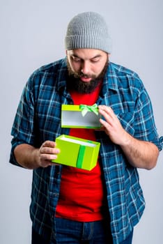 young bearded man with green gift box