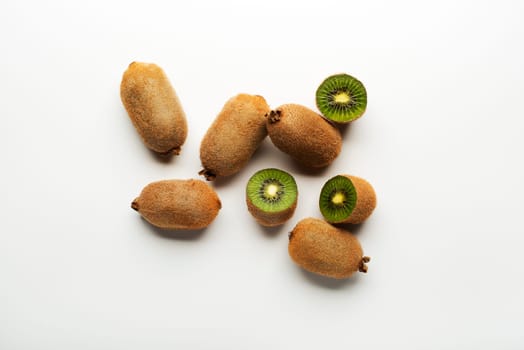 Kiwi fruits on white background overhead shoots.