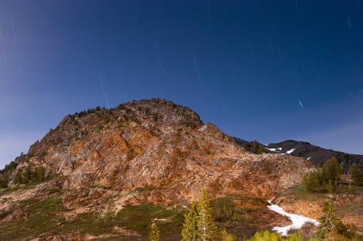 Star trails above a mountain near the base of Snowbird Utah
