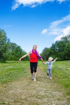 A woman with a child on the sports outing