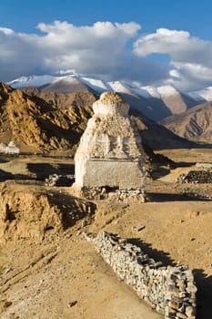 Buddhist stupas near the Shey monastery against the Himalayas mountains (Ladakh, north India)