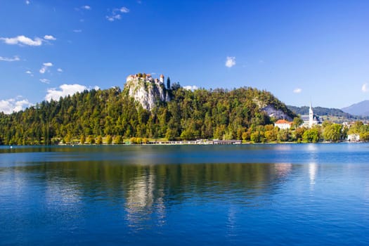 Colorful Bled in fall, with the rock top castle, Slovenia