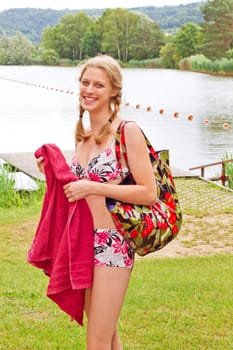 Young woman at the bathing lake
