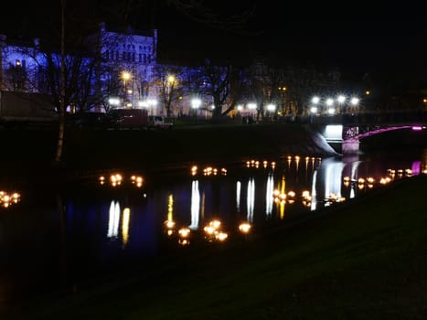 Riga park view at night with lights on water