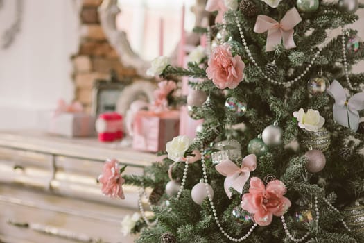 New Year's and Christmas interior in pink color with a dresser, a wall mirror, gifts, candles