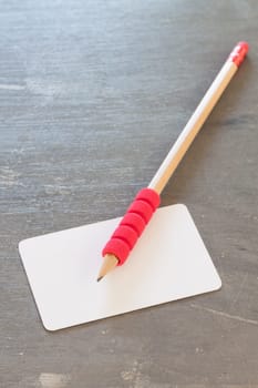 Name card on grey background, stock photo