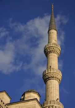 Minaret of the Blue Mosque in Istanbul, Turkey, taken over blue sky