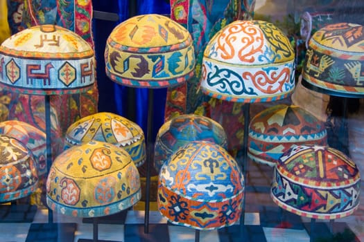Arabic Needlework decorated caps in Turkish market shop, Istambul
