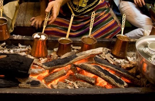 How to prepare a good Turkish coffee with original handmade copper coffee pots over embers