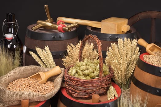 Beer barrels,beer bottle,hammer and tap with wheat,barley,hops and malt