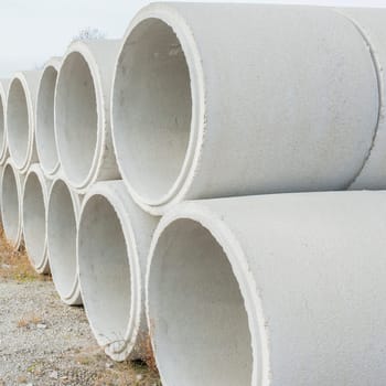 Concrete drainage pipes for industrial building construction.