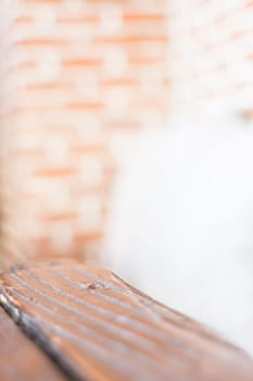 Grey pillow on a brick wall background, stock photo