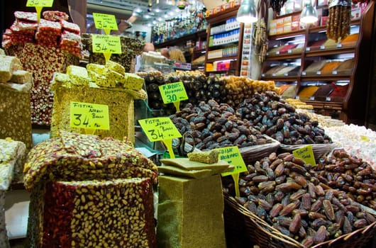 Showing of Turkish sweets, dried fruits and nuts in a stall in the Istanbul spice market