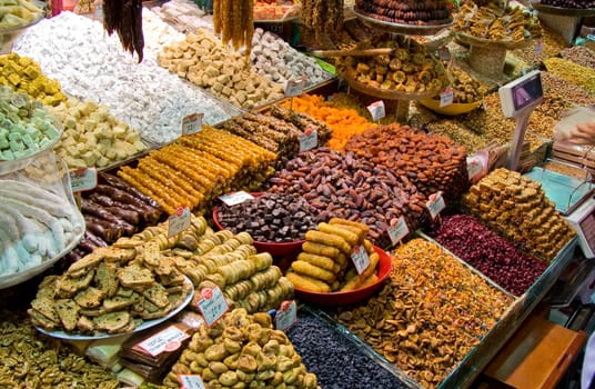 Showing of Turkish sweets, dried fruits and nuts in a stall in the Istanbul spice market