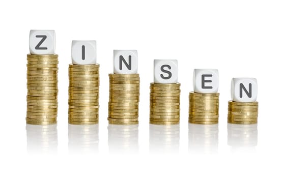 Coin stack with letter cubes - interest