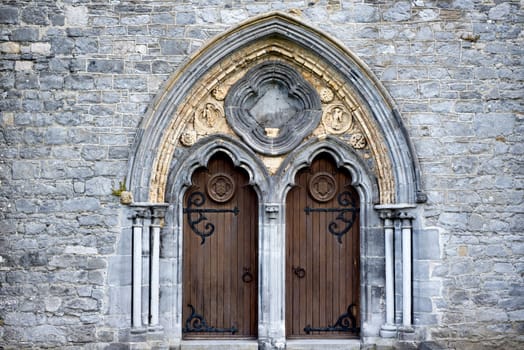 double arched wooden doors in to  St Canice’s Cathedral kilkenny ireland