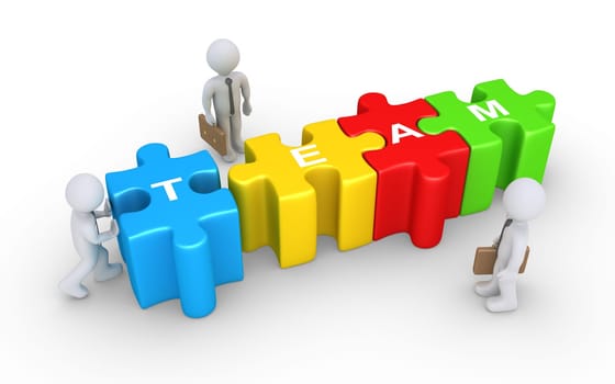 Businessman is pushing the last puzzle piece to complete the word TEAM and two others are watching