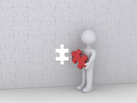 Person is holding the last puzzle piece of a big wall of many pieces
