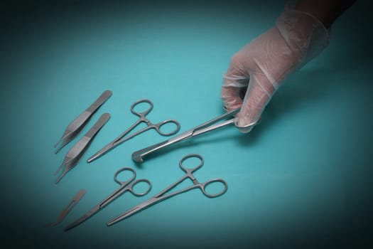 Hand and various scissors