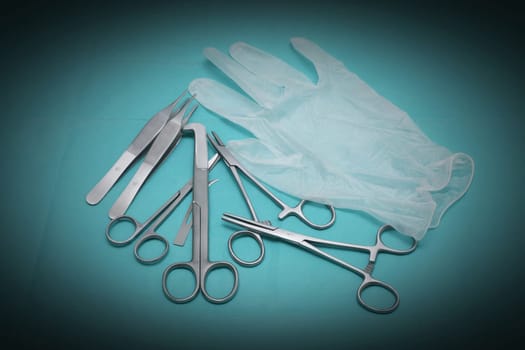 Various scissors and a rubber glove