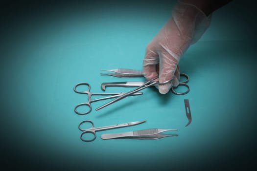Hand and various scissors