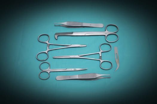 Different scissors on blue background