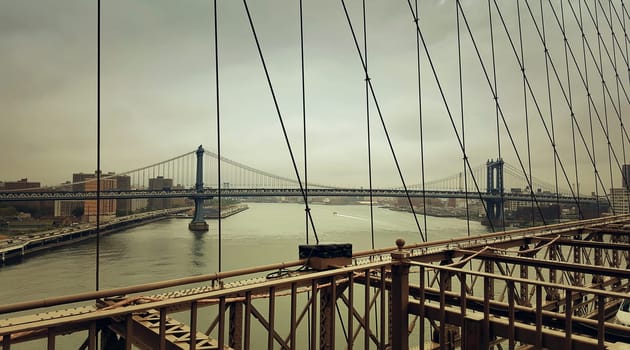 A look from Brooklyn Bridge to Manhattan Bridge over Hudson River in New York City