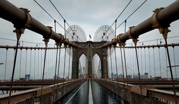 Brooklyn Bridge closeup over Hudson River in New York City