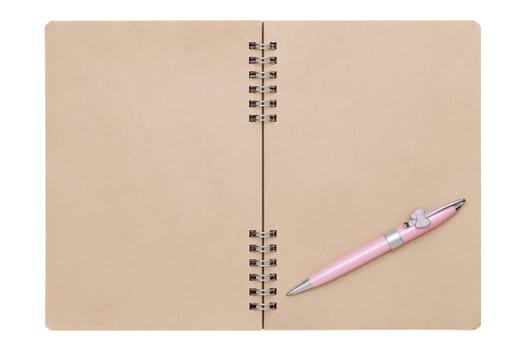 blank spiral brown notebook with ball point pen isolated on white background