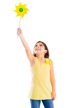 Beautiful girl blowing a plastic windmill