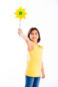 Beautiful girl blowing a plastic windmill