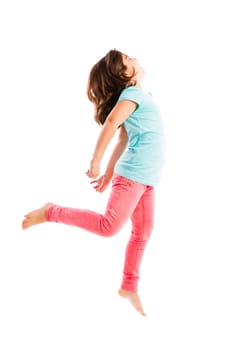 Beautiful and happy young girl jumping