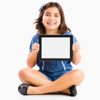 Young girl sitting on floor and showing something on a tablet