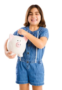 Young girl start her savings on a piggybank