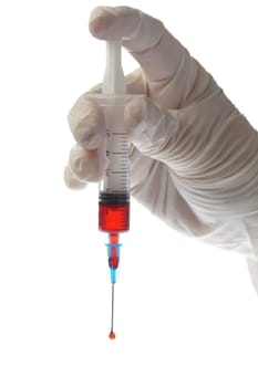 Hand with blood sample in syringe on white background