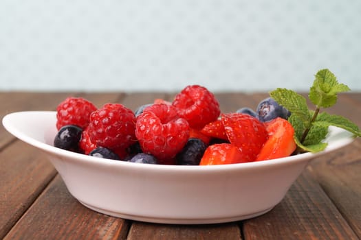 Delicious marinated fruitsalad, red juicy and ready to eat