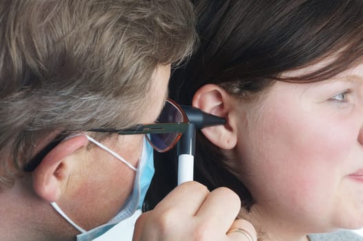 Ear doctor examines a child. Hospital examination