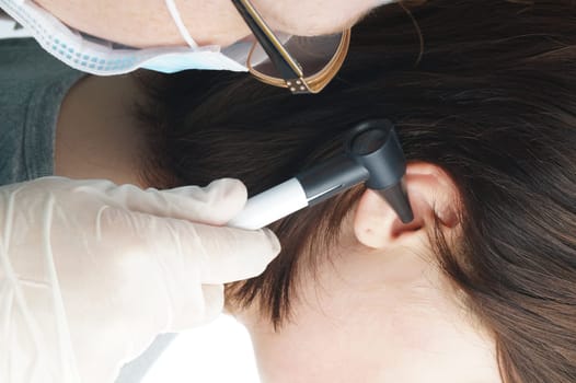 Ear doctor examines a child. Hospital examination