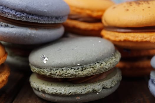 orange and blue macaroons filled with ganache