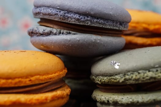 orange and blue macaroons filled with ganache