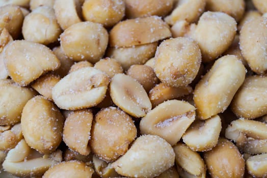pile of roasted peanuts in a bowl