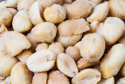 pile of roasted peanuts in a bowl