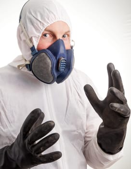 Man in protective suit, gloves and a respiraton
